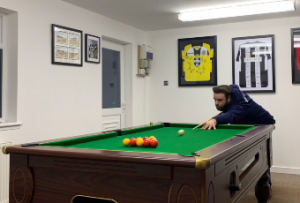 John Mccormack playing pool to avoid burnout in IT